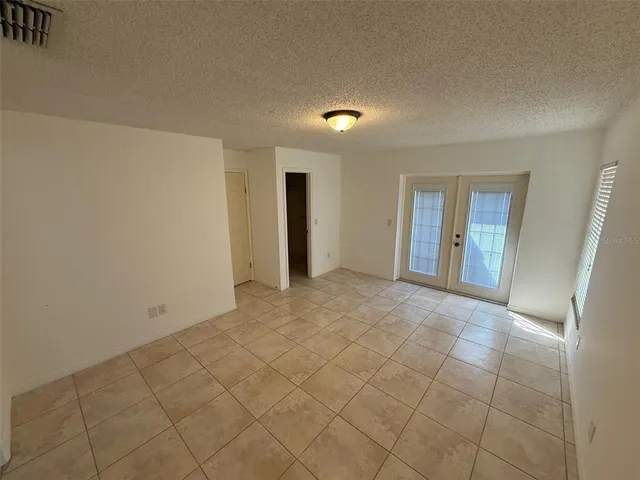 a view of an empty room and a window