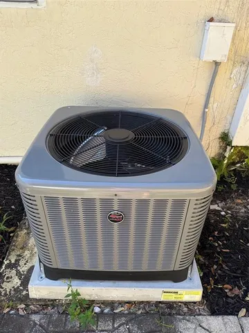 a bathroom with a toilet and a mirror