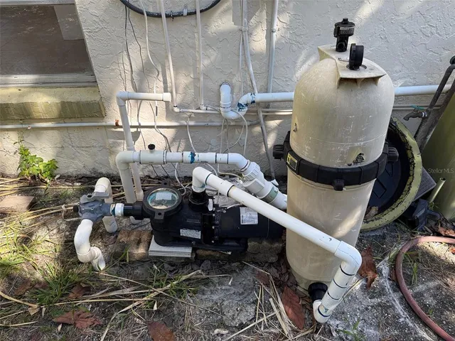 a view of a backyard with a small pool