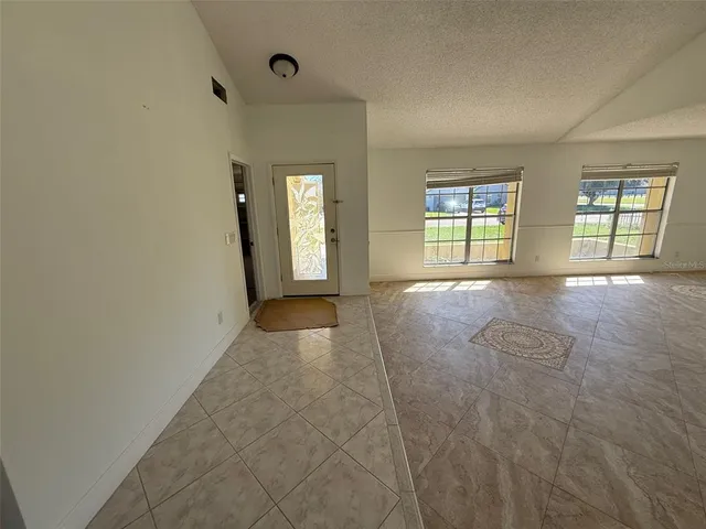 a view of an empty room and window