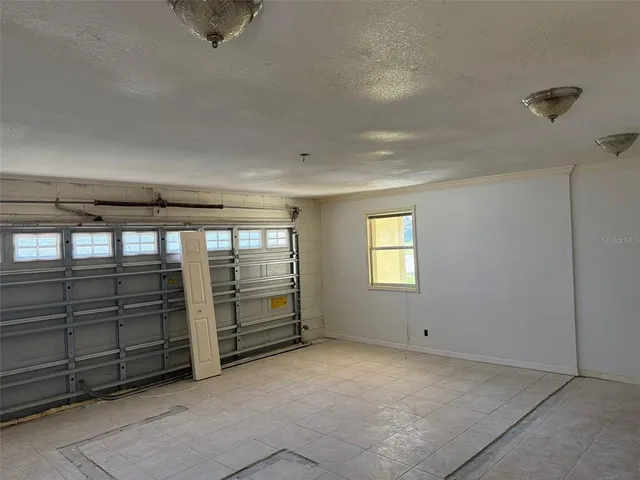 a view of an empty room with windows