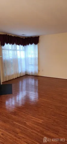 a view of room with hardwood floor