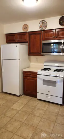 a kitchen with stainless steel appliances a stove and a refrigerator