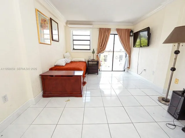a living room with a couch and a flat screen tv