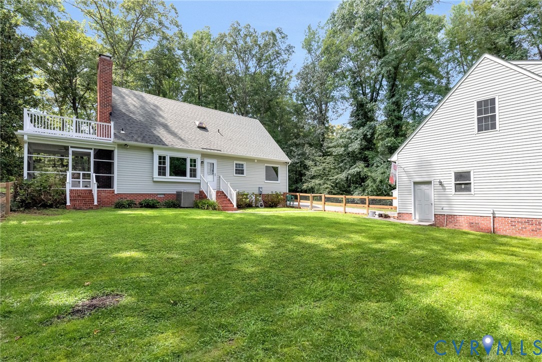 10478 Gould Hill Road Hanover, VA 23069 - Photo 53 of 63 Expansive green lawn with mature trees and a fence