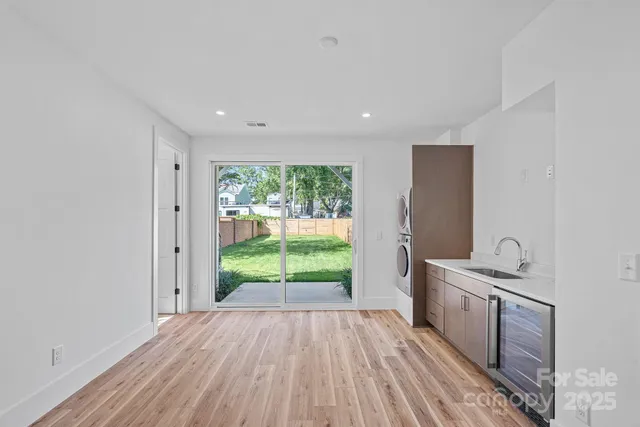 a view of a room with wooden floor and staircase