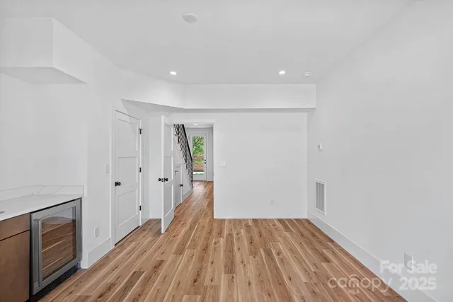 a view of a kitchen with a sink and cabinets