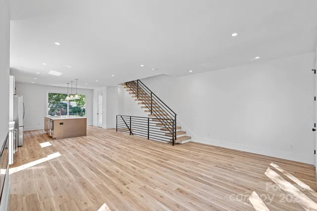 a kitchen with windows and refrigerator