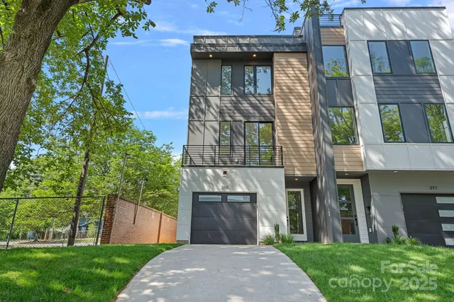an aerial view of a house with swimming pool and furniture