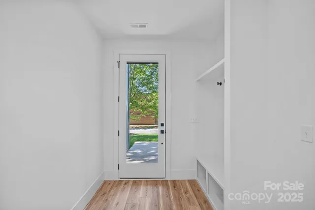 a view of entryway with wooden floor