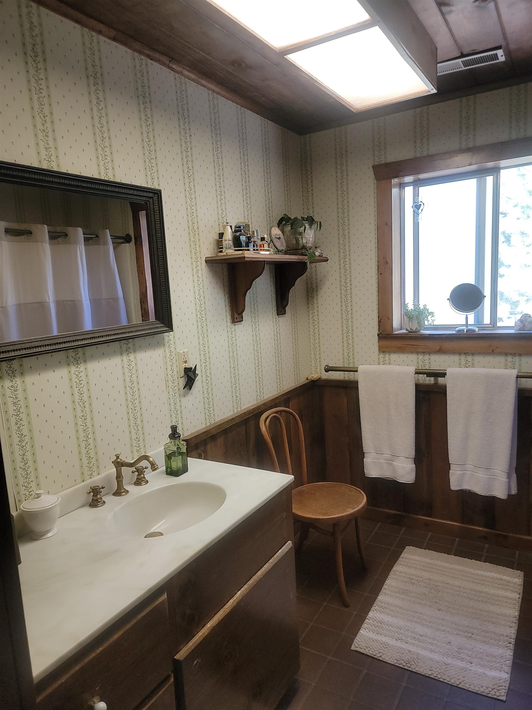 11702 Twin Lakes Road Bridgeport, CA 93517 - Photo 13 of 21 Bathroom featuring a wood-finish vanity with an integrated sink and brass-finish faucet