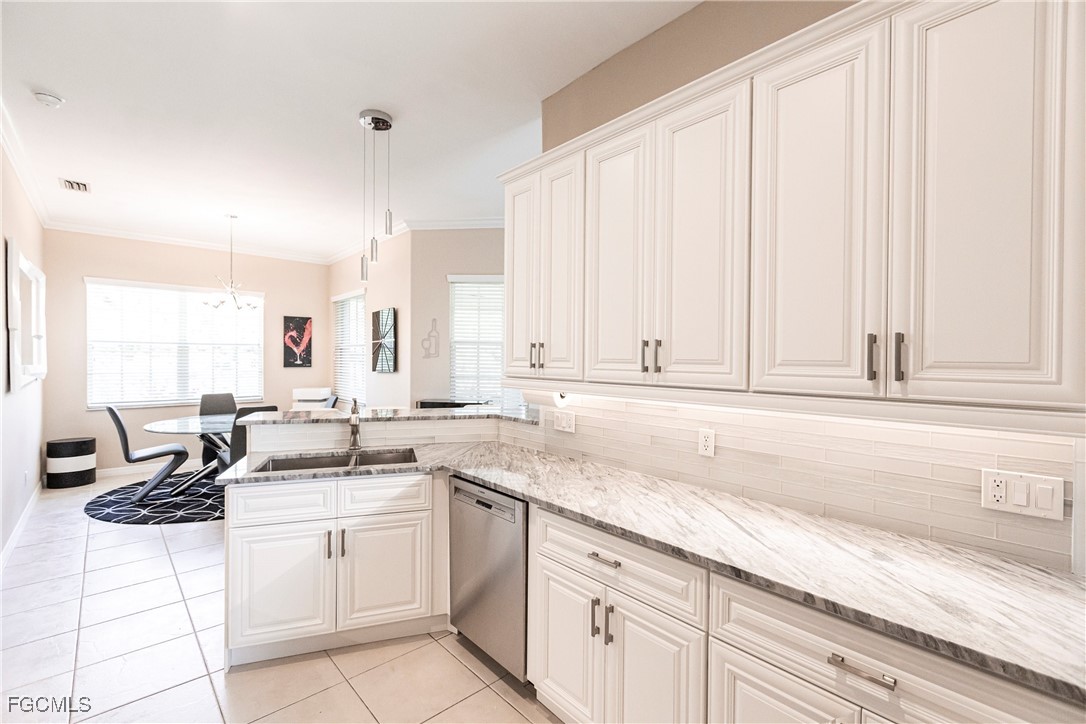 9013 West Ridge Court Fort Myers, FL 33912 - Photo 15 of 43 a kitchen with appliances cabinets and a sink