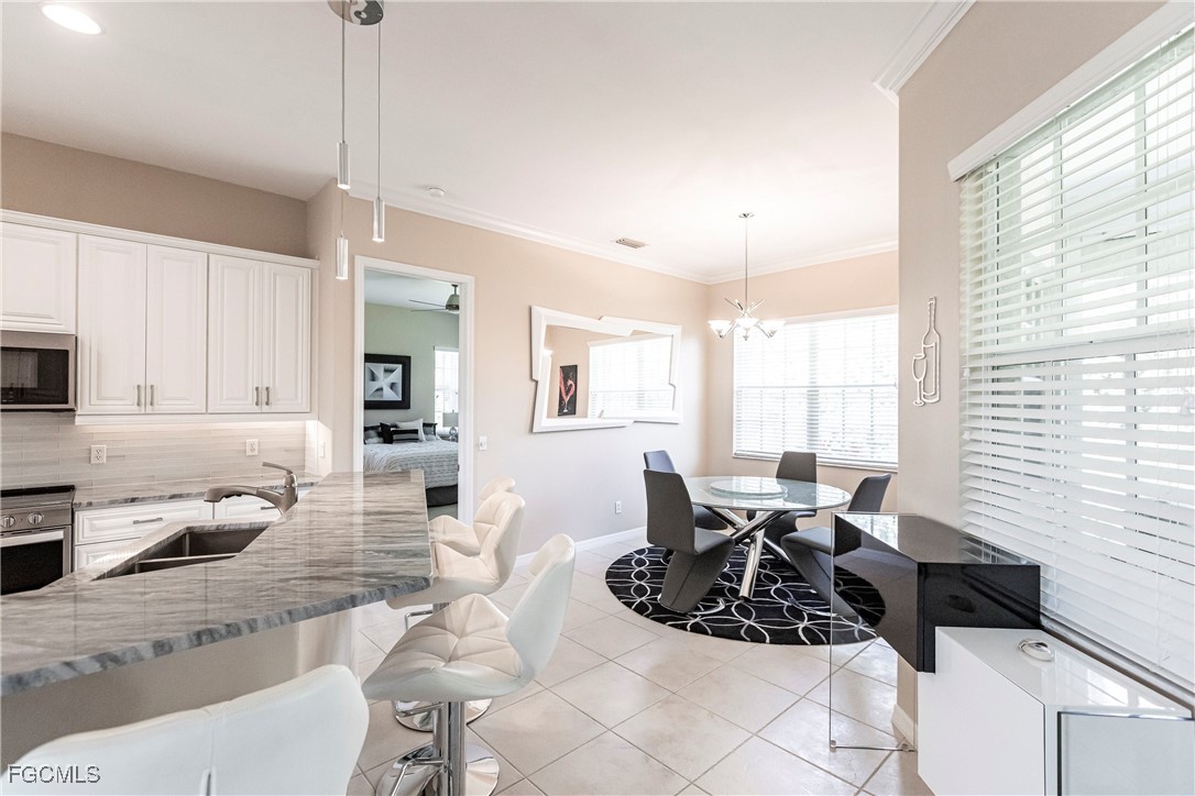 9013 West Ridge Court Fort Myers, FL 33912 - Photo 17 of 43 a view of a dining room with furniture window and outside view