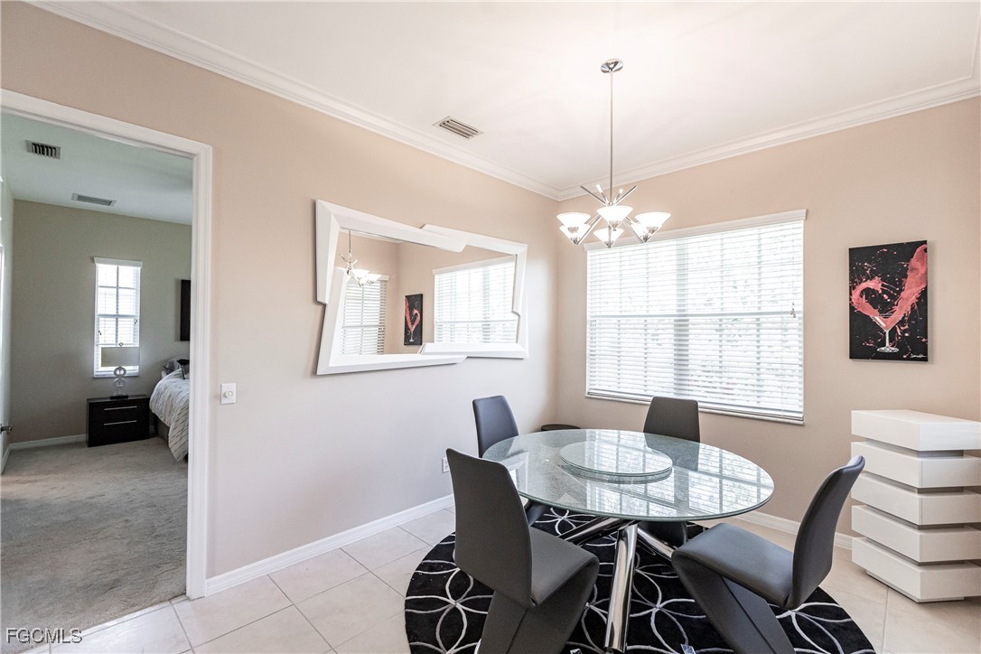 9013 West Ridge Court Fort Myers, FL 33912 - Photo 18 of 43 a view of a dining room with furniture and window