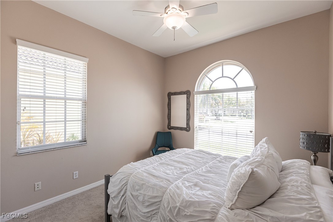 9013 West Ridge Court Fort Myers, FL 33912 - Photo 28 of 43 a bedroom with a bed and a window