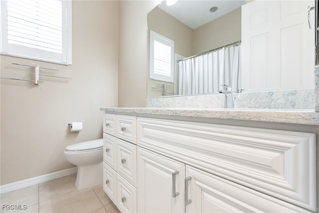 9013 West Ridge Court Fort Myers, FL 33912 - Photo 30 of 43 a bathroom with a sink and a toilet