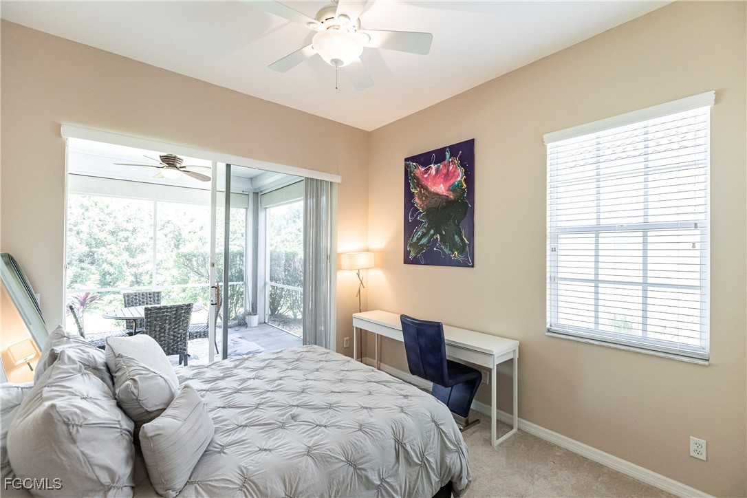 9013 West Ridge Court Fort Myers, FL 33912 - Photo 31 of 43 a bedroom with a bed and a table with chair