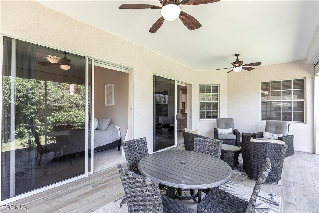 9013 West Ridge Court Fort Myers, FL 33912 - Photo 34 of 43 a living room with furniture a rug and a chandelier