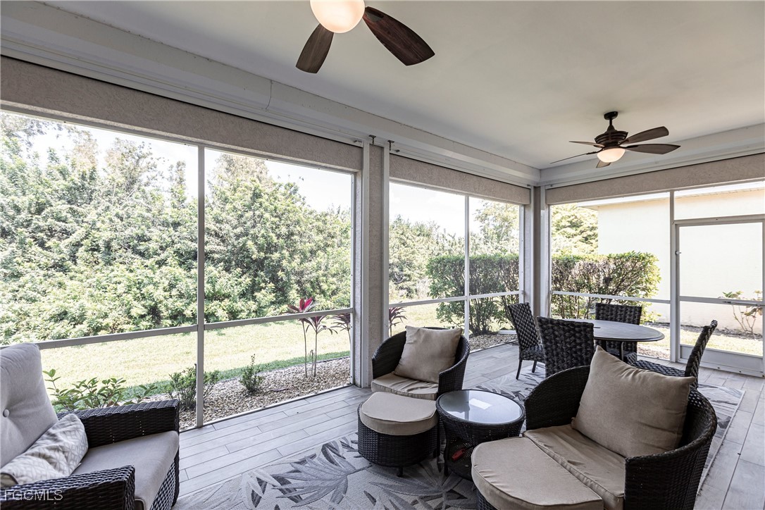 9013 West Ridge Court Fort Myers, FL 33912 - Photo 37 of 43 a living room with furniture and a large window