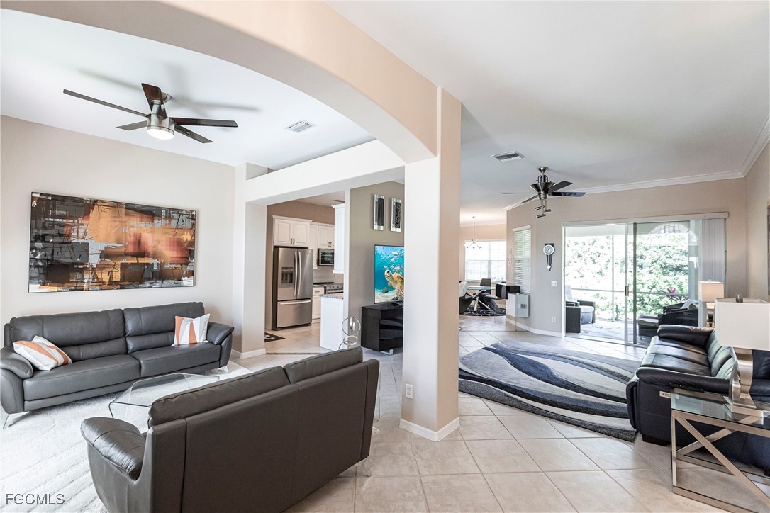 9013 West Ridge Court Fort Myers, FL 33912 - Photo 7 of 43 a living room with furniture and a large window