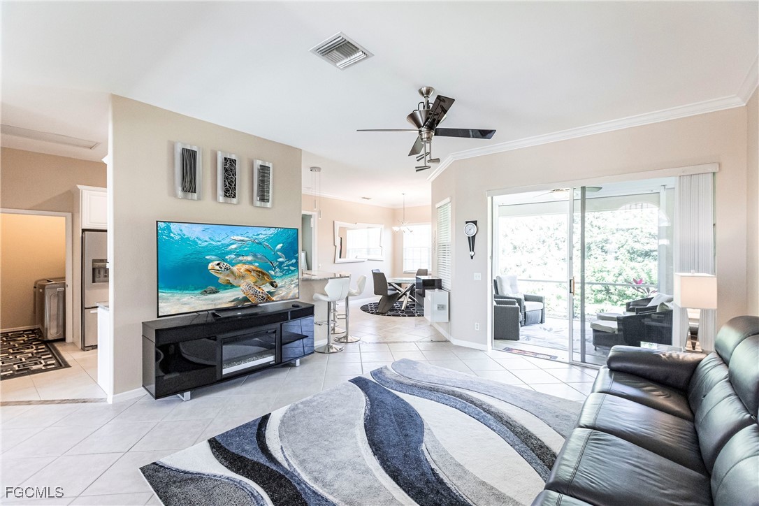 9013 West Ridge Court Fort Myers, FL 33912 - Photo 9 of 43 a living room with furniture and a flat screen tv
