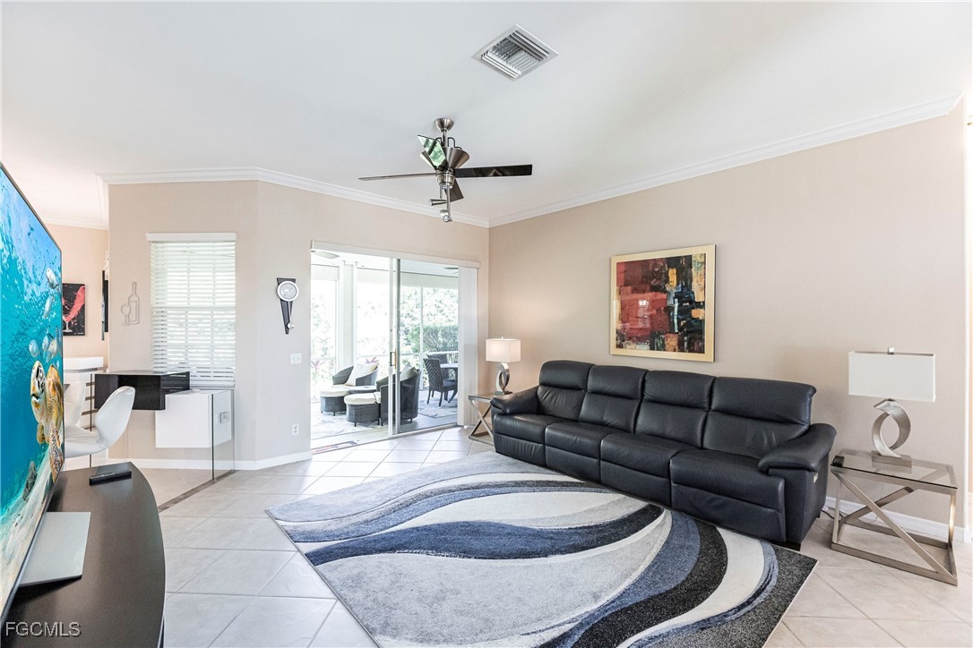 9013 West Ridge Court Fort Myers, FL 33912 - Photo 10 of 43 a living room with furniture and a chandelier