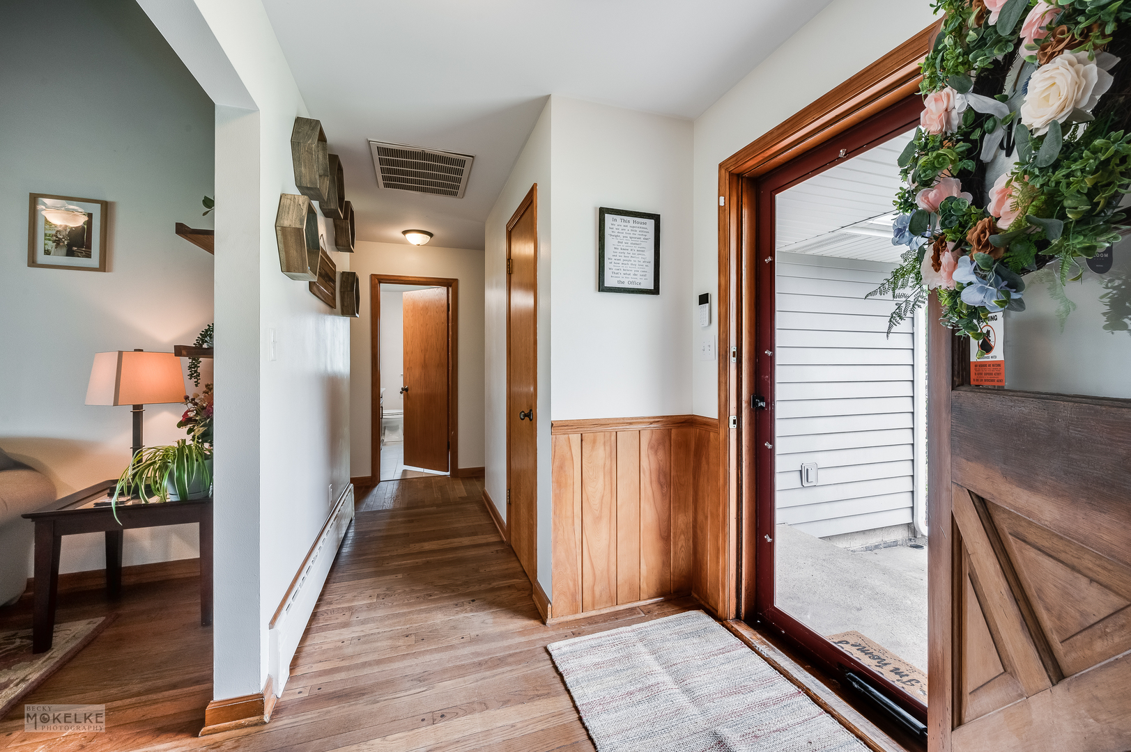 2512 Caton Farm Road Joliet, IL 60435 - Photo 24 of 41 a view of a hallway with wooden floor and stairs