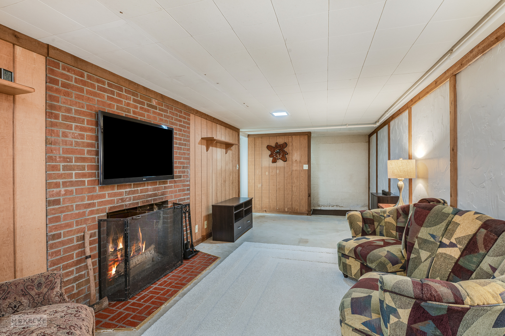 2512 Caton Farm Road Joliet, IL 60435 - Photo 34 of 41 a living room with furniture fireplace and flat screen tv