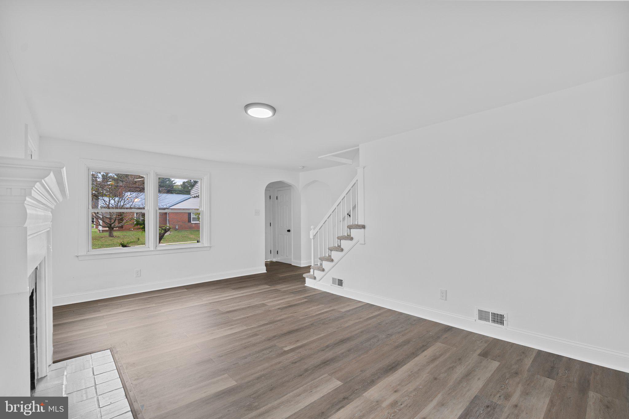 300 Avon Road Hagerstown, MD 21740 - Photo 9 of 28 an empty room with wooden floor and window