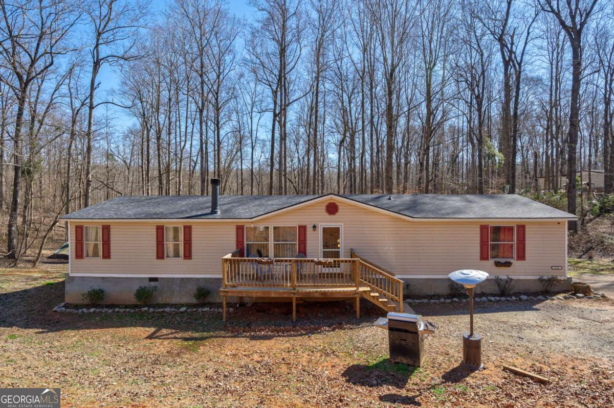 218 Sol Drive Commerce, GA 30529 - Photo 1 of 48 a front view of a house with garden