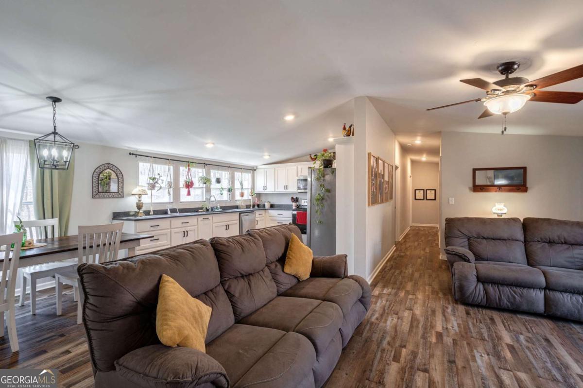 218 Sol Drive Commerce, GA 30529 - Photo 11 of 48 a living room with furniture and kitchen view