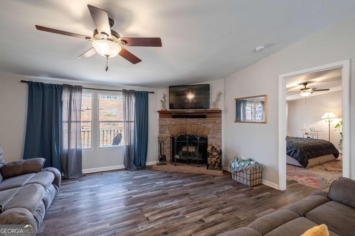 218 Sol Drive Commerce, GA 30529 - Photo 20 of 48 a living room with furniture and a fireplace