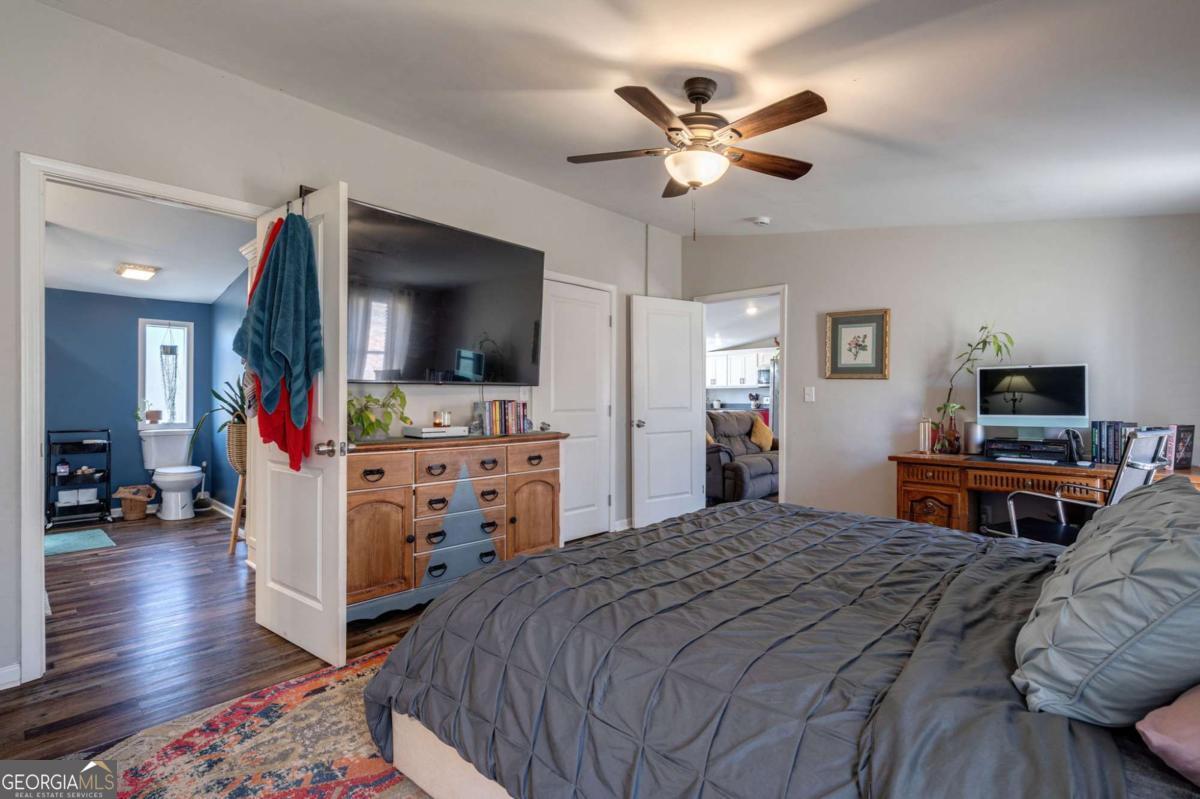 218 Sol Drive Commerce, GA 30529 - Photo 23 of 48 a bedroom with a bed and a flat screen tv