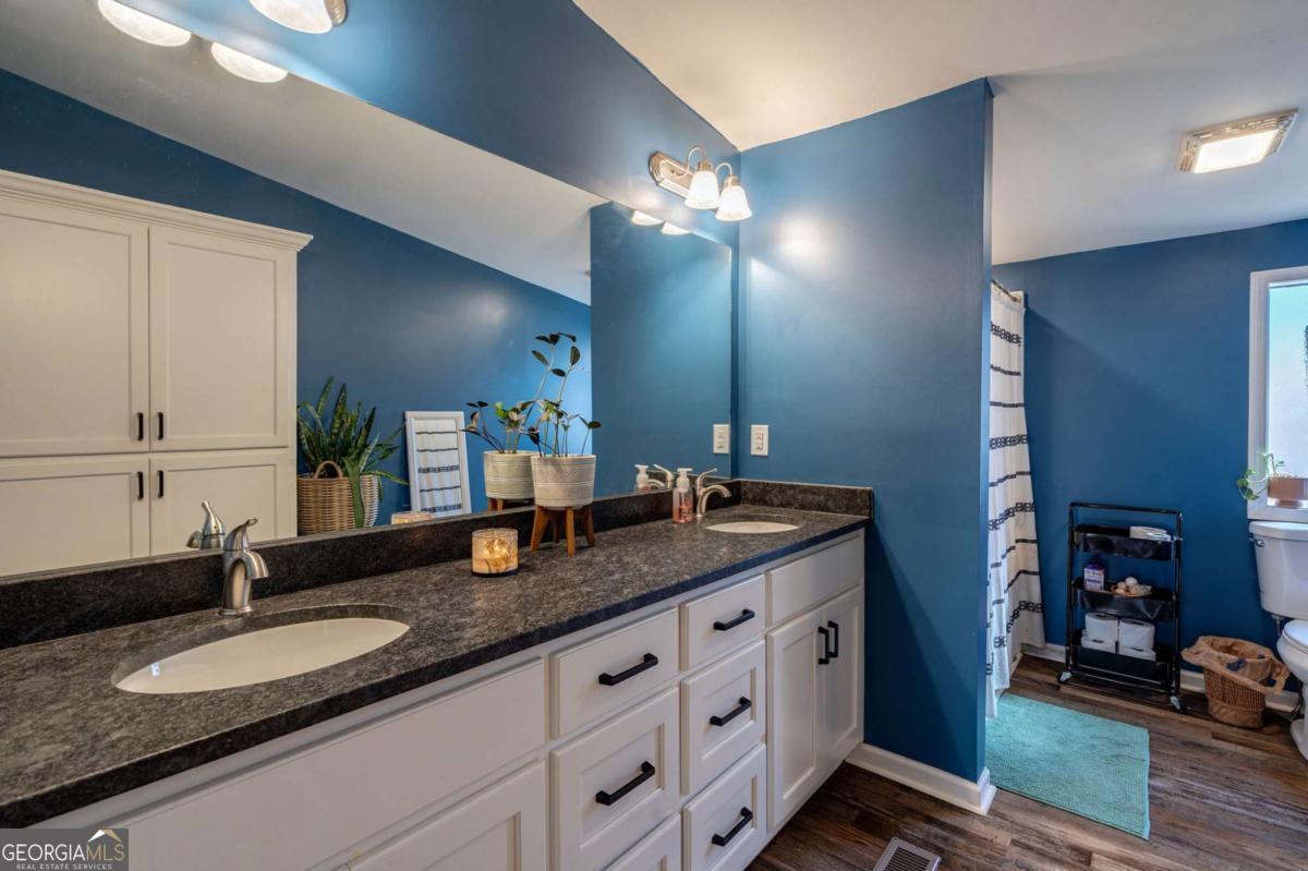 218 Sol Drive Commerce, GA 30529 - Photo 24 of 48 a bathroom with double vanity and a mirror