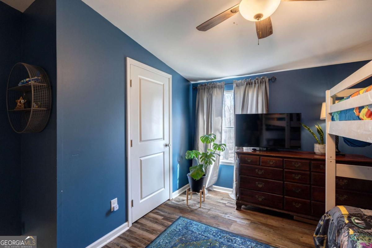 218 Sol Drive Commerce, GA 30529 - Photo 26 of 48 a living room with furniture and a flat screen tv