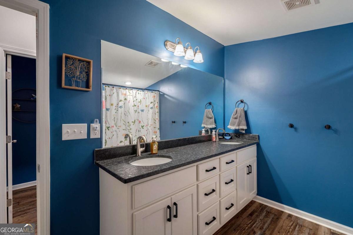 218 Sol Drive Commerce, GA 30529 - Photo 28 of 48 a bathroom with a sink and a mirror