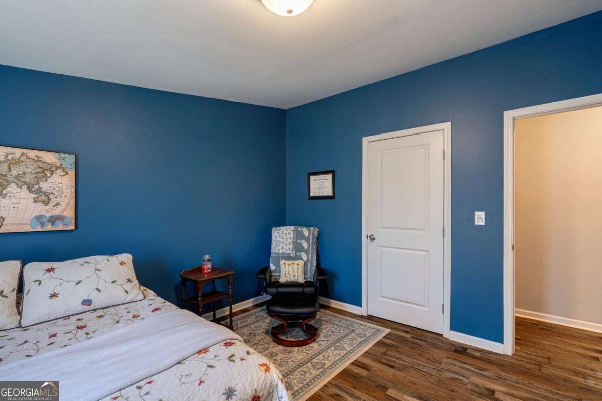 218 Sol Drive Commerce, GA 30529 - Photo 30 of 48 a bedroom with a bed and wooden floor