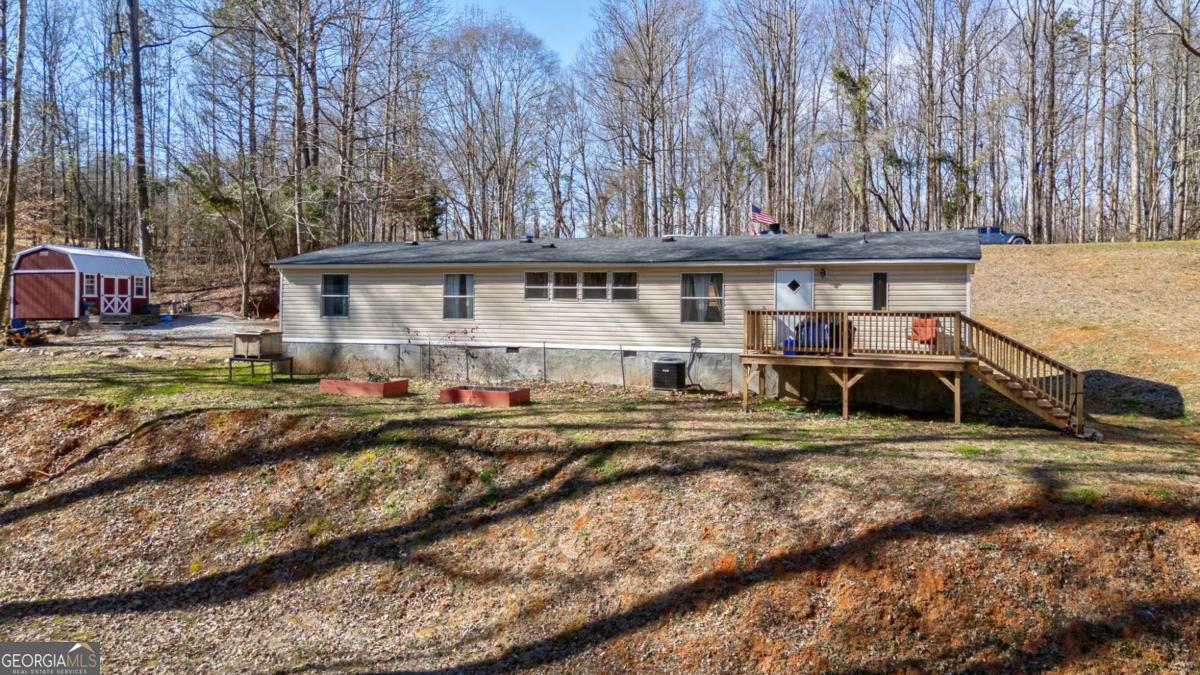 218 Sol Drive Commerce, GA 30529 - Photo 33 of 48 a view of a house with a bed and trees