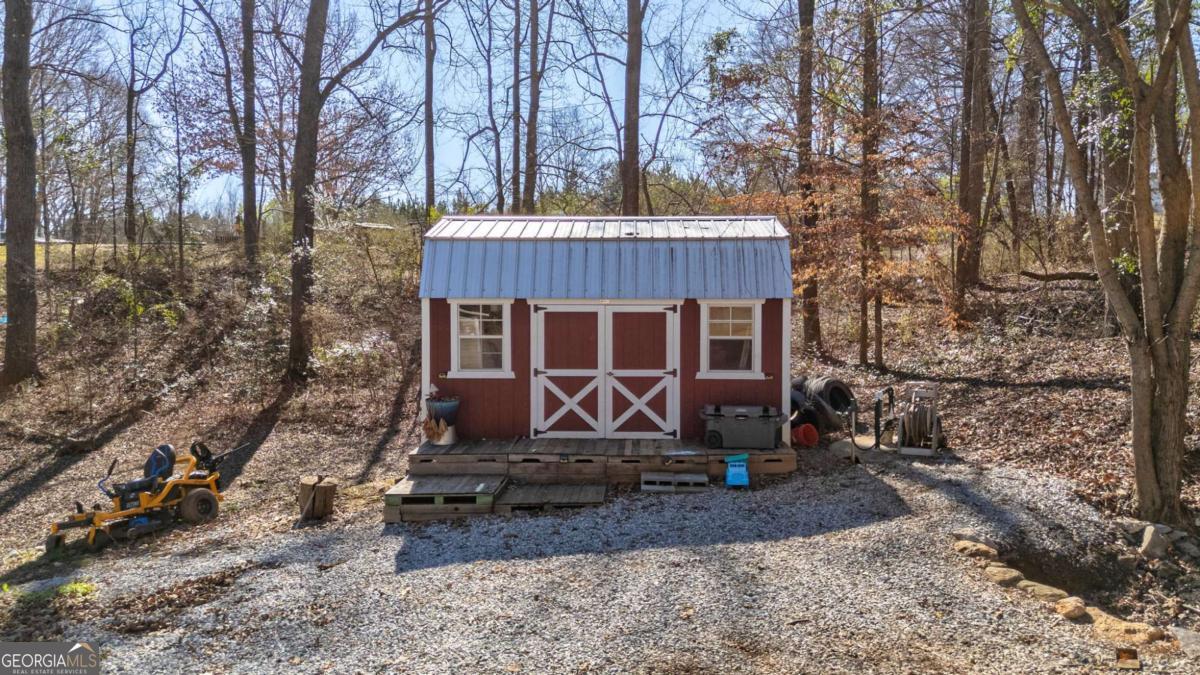 218 Sol Drive Commerce, GA 30529 - Photo 4 of 48 a front view of a house with garden