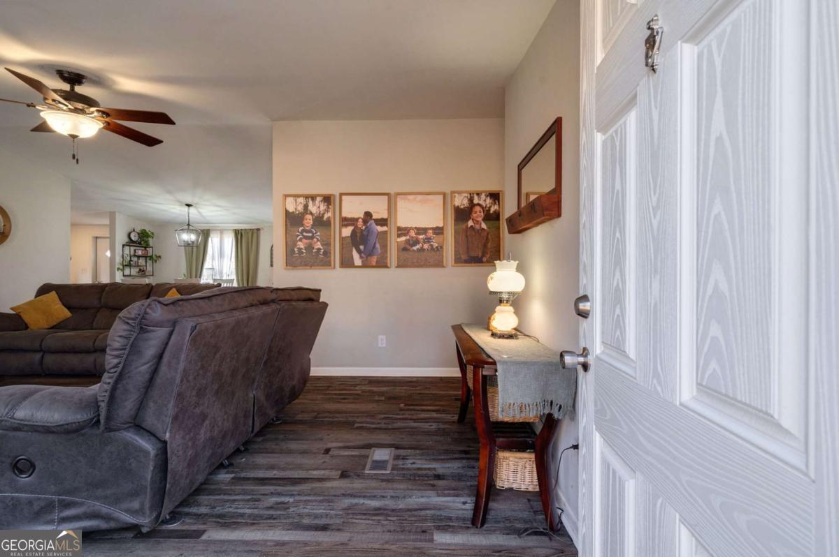 218 Sol Drive Commerce, GA 30529 - Photo 8 of 48 a living room with furniture and a wooden floor