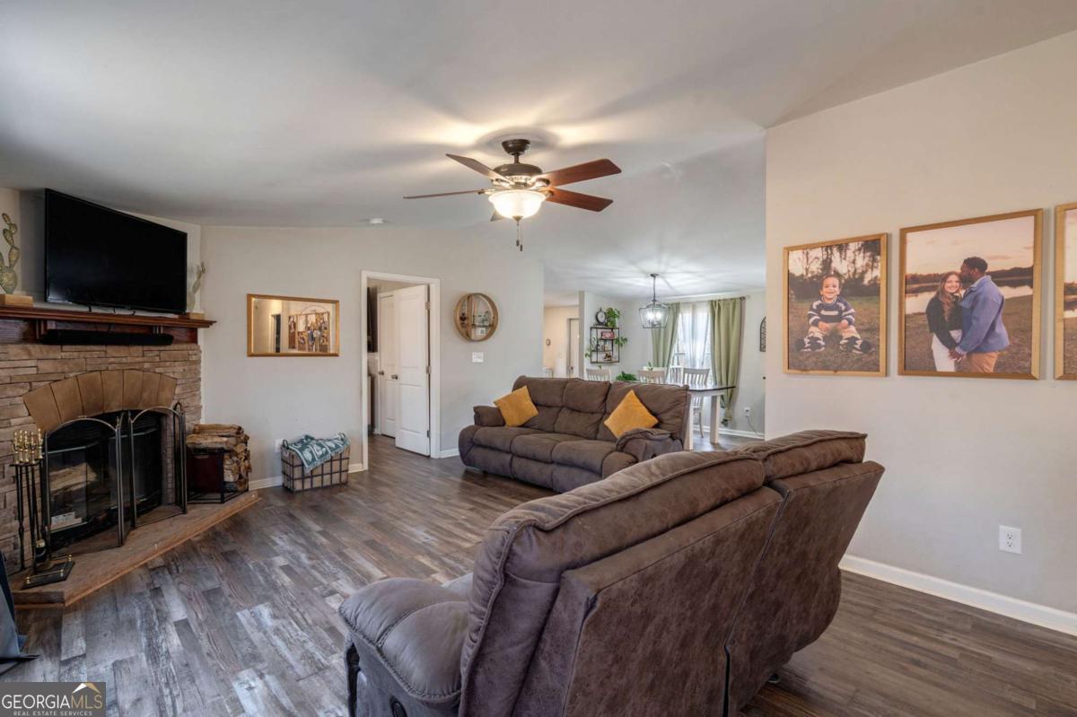218 Sol Drive Commerce, GA 30529 - Photo 9 of 48 a living room with furniture and a flat screen tv