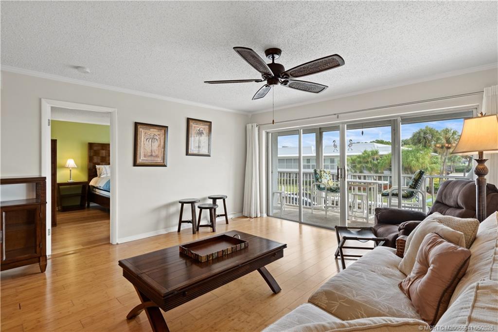 1866 Southwest Palm City Road, Unit 204 Stuart, FL 34994 - Photo 5 of 38 a living room with furniture and a window