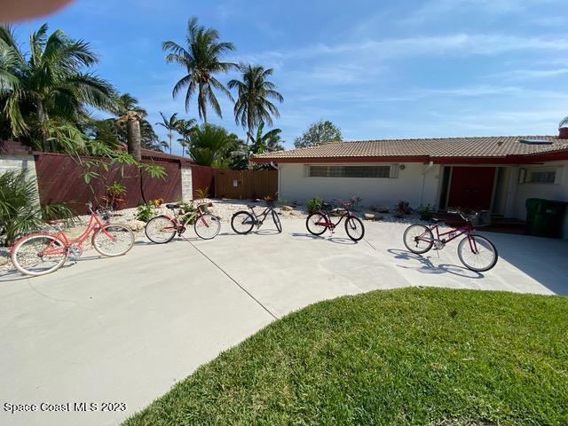 146 Bimini Road Cocoa Beach, FL 32931 - Photo 35 of 41 a couple of bicycles parked next to a road
