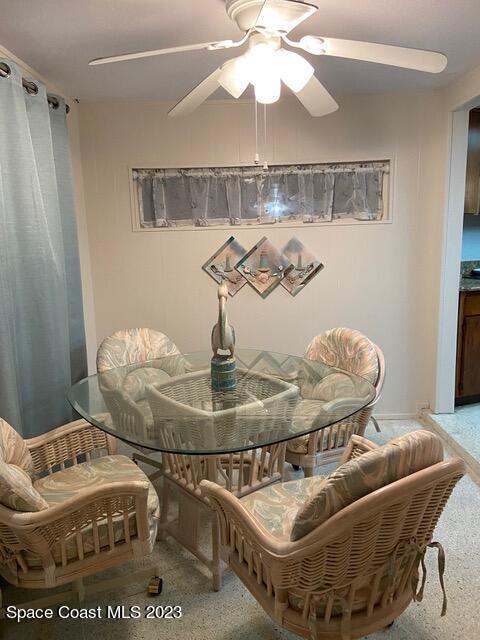 146 Bimini Road Cocoa Beach, FL 32931 - Photo 7 of 41 a living room with furniture and a chandelier