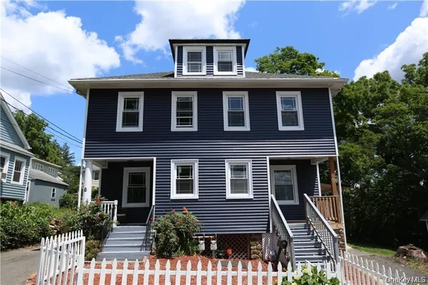 a front view of a house with yard