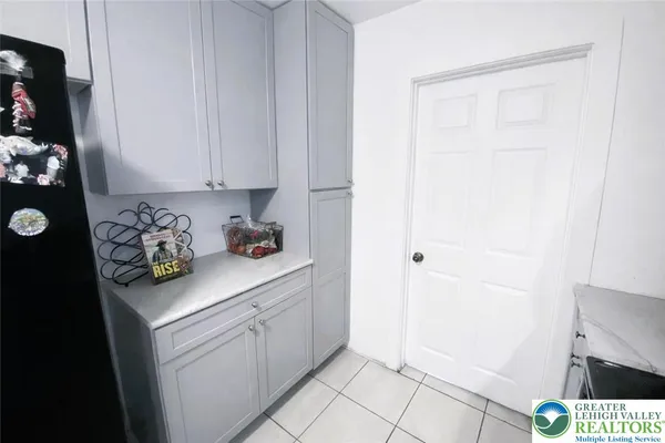 a utility room with cabinets washer and dryer