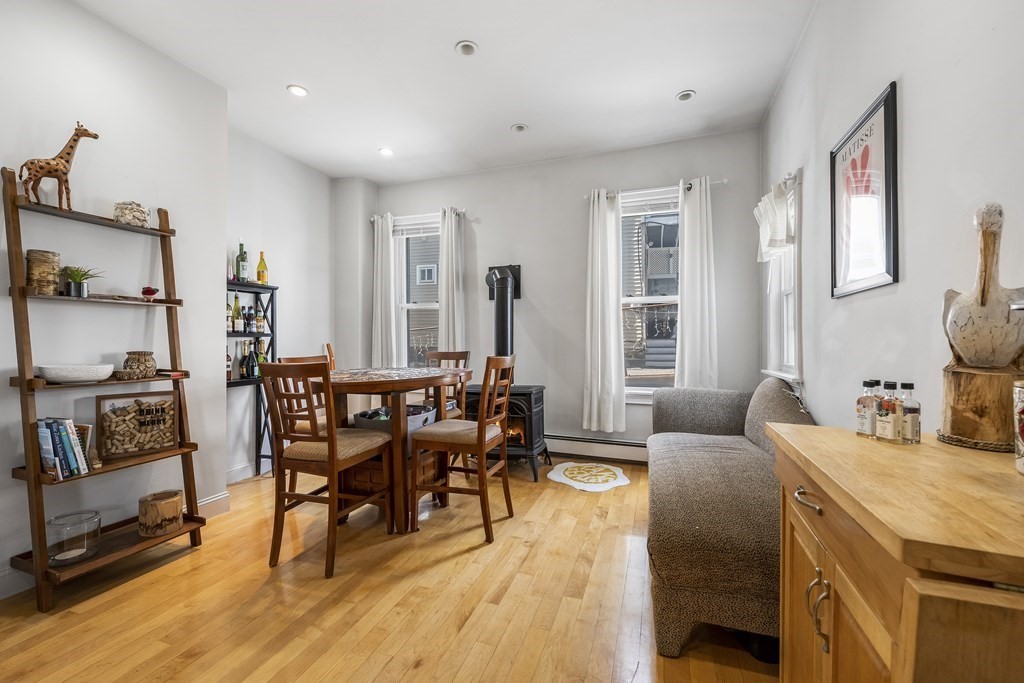 866 East 5th Street, Unit 1 Boston, MA 02127 - Photo 8 of 23 a view of a livingroom with furniture and a dining table