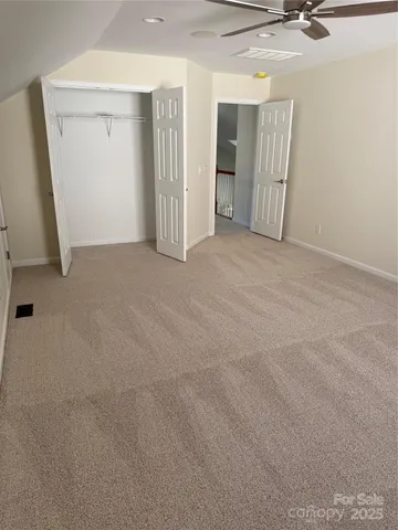 front view of a house with a tree