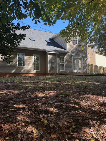 a view of outdoor space with deck and tree