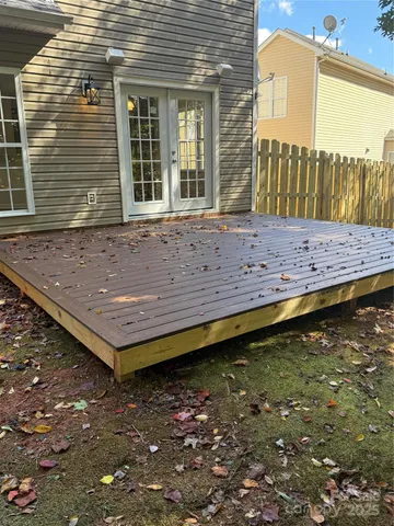 a view of outdoor space with deck and tree